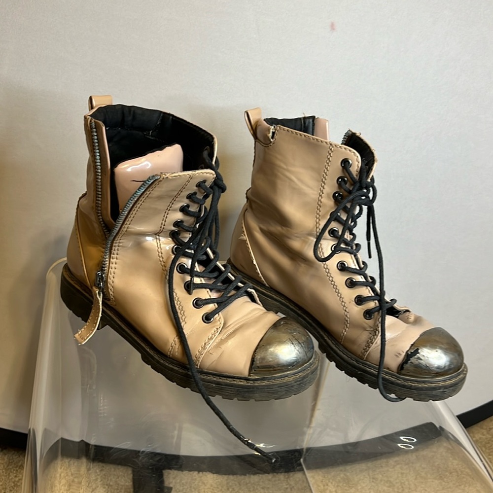 Combat boots with playa dust on them still size 7 and very broken in condition.